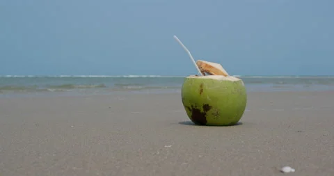 Fresh coconut drink on beach Stock Footage 131570876