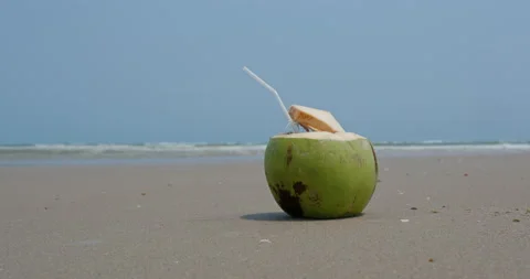 Fresh coconut drink on beach Stock Footage 131872543