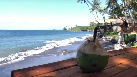 Fresh coconut drink with tropical beach backround Stockbeeldmateriaal 337209933