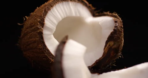 Fresh coconut rotating on a black background. Stock Footage 142431218