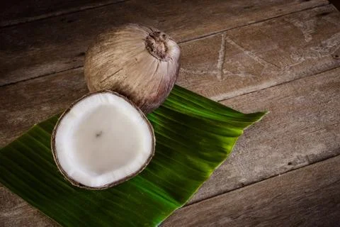 Fresh coconuts on banana leaf Stock Photos