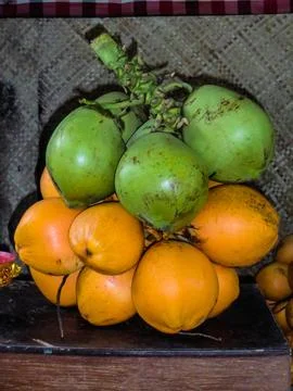 Fresh coconuts being sold at roadside stall in Gili Islands, Bali, Lombok, Indon Stock Photos