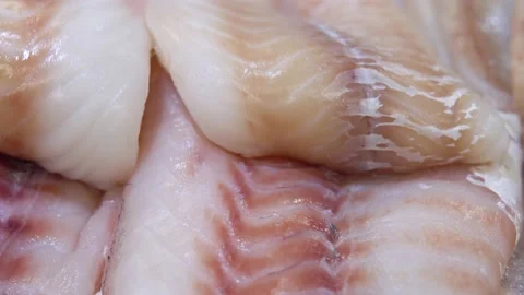 Fresh cod fillet lying on ice in a supermarket Stock Footage 185638214
