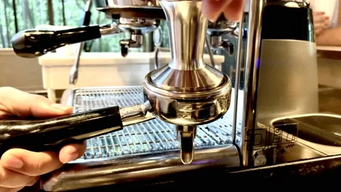 Fresh Coffee bean pressed with tamper Stock Footage 142321542