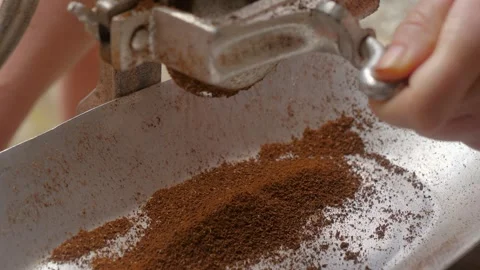 Fresh coffee beans being ground into fine powder. Stock Footage 323425070