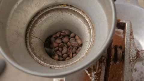 Fresh coffee beans being ground into fine powder. Stock Footage 323425143