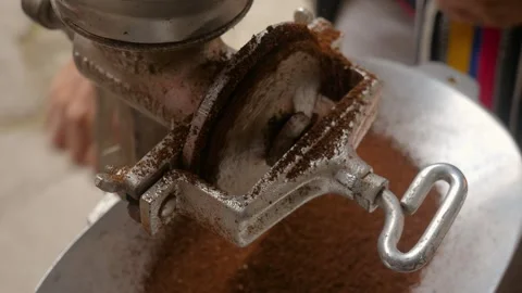 Fresh coffee beans being ground into fine powder. Stock Footage 323425239