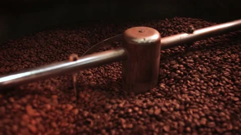 Fresh coffee beans mix on a roast machine in a coffee shop. Stock Footage 147103055