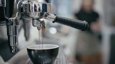 Fresh coffee from espresso machine brew into coffee cup and steam Stock-Footage 107703747