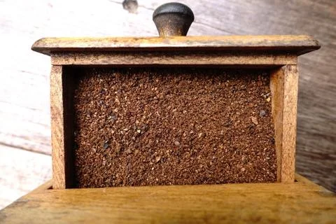 Fresh coffee in grinder Stock Photos