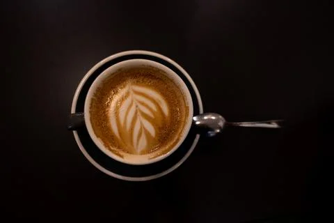 Fresh coffee with a milk pattern and foam. Cappuccino in a ceramic cup Stock Photos