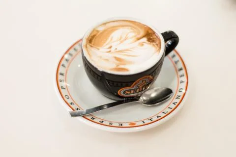 Fresh coffee on white table Stock Photos