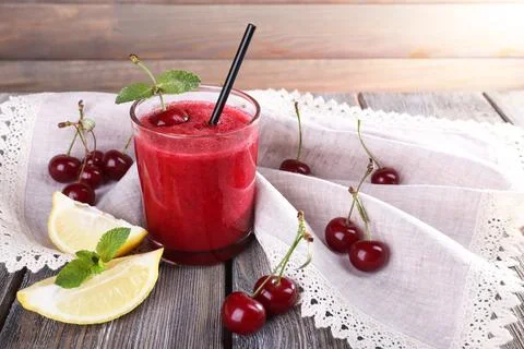 Fresh cold cherry cocktail with mint and lemon Stock Photos