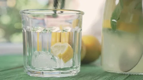 Fresh cold lemonade with mint and ice, outdoors shot. Stock Footage 166050232
