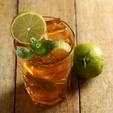 Fresh cold tea with lime, mint and lemon Stock Photos