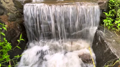 Fresh cold water flowing through canal to Rice Farms. Soil moistening system 動画素材 202085032
