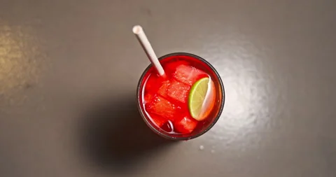 Fresh Cold Watermelon Cocktail with Lime on Bar Table Stock Footage 344979147