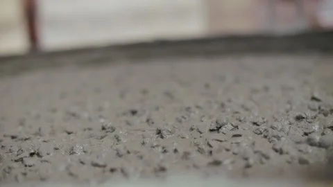 Fresh concrete pouring into container at construction site Stock Footage 315957543