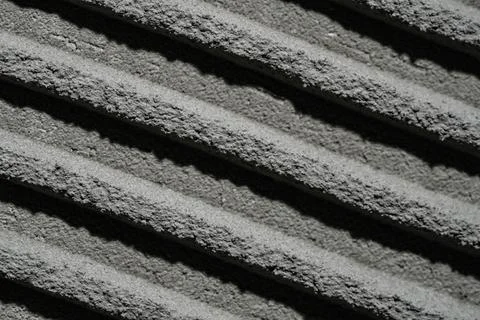 Fresh concrete tehture with patterns of notched trowel. Macro shot of grey Stock Photos