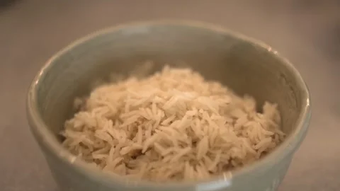 Fresh Cooked Basmati Rice with Garlic Stock Footage 314286697