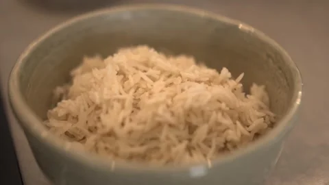 Fresh Cooked Basmati Rice with Garlic Stock Footage 314286773