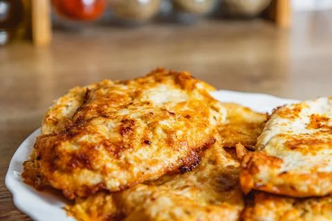 Fresh cooked chicken chops on a white plate on the table close up Stock Photos