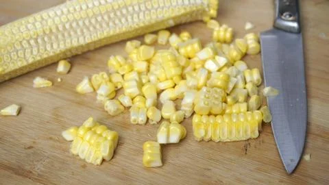 Fresh cooked corn is removed from the stem (cob of corn)  Stock Photos