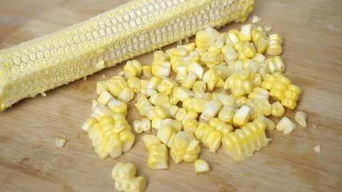 Fresh cooked corn is removed from the stem (cob of corn)  Stock Photos
