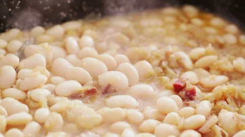 Fresh cooked white beans steaming in casserole- closeup Stock Footage 35981652