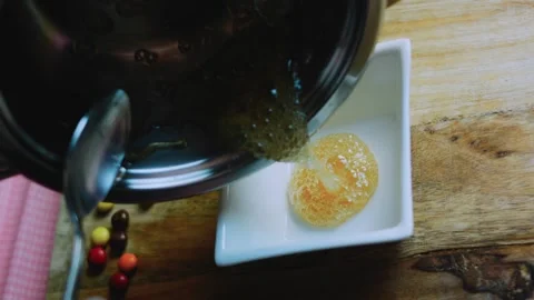 Fresh cooking study of golden caramel coating the square dish Stock Footage 342153998