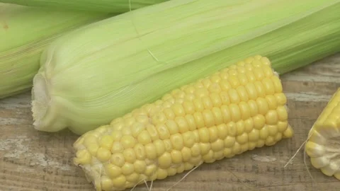 Fresh Corn and Celery Complement Each Other Beautifully on a Rustic Wooden Stock Footage 282019287