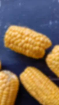 Fresh corn blur photo on black background Stock Photos