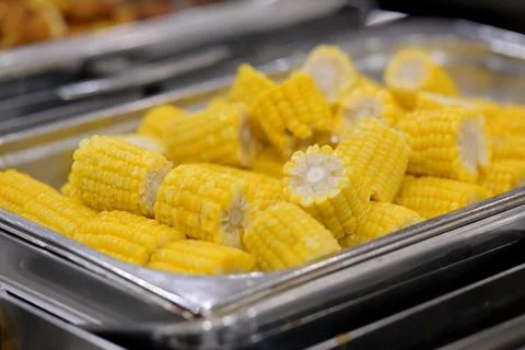 Fresh corn on the cob pieces in a serving tray Stock Photos
