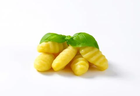 Fresh corn kernels with basil leaves Stock Photos