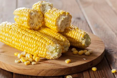 Fresh corn on wooden table Stock Photos