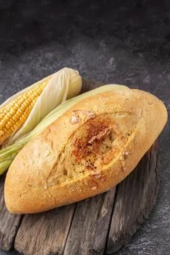 Fresh cornbread and corn grains on the table. Food grain crisis concept. Cl.. Stock Photos