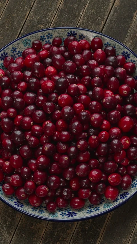 Fresh cranberries on a decorative platter. Vertical video. Stock Footage 321064220