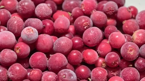 Fresh cranberries piled high on a table, ideal for decoration or cooking Stock Footage 345168434