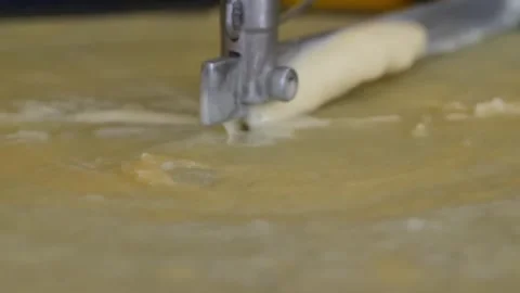 Fresh Crepe Being Spread on a Hot Griddle Stock Footage 345692643