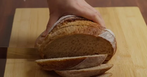 Fresh Crisp Sourdough Bread On Table. Cutting French Multigrain Bread For Toast Stock-Footage 324821820