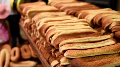 Fresh crispy delicious bread lies on open stall of market. Stock Footage 243170184