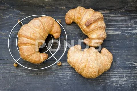 Fresh croissant on a dark background Stock Photos