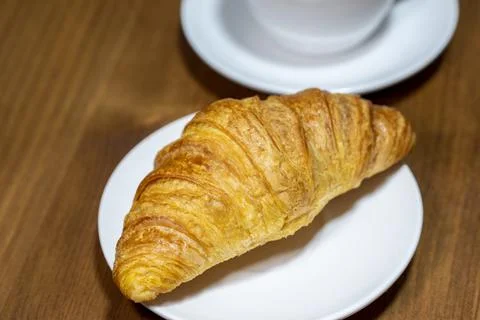 Fresh croissant on a rustic background Stock Photos