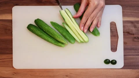 Fresh Cucumber Dicing on Cutting Board Top View Cooking Preparation Stock Footage 333782295