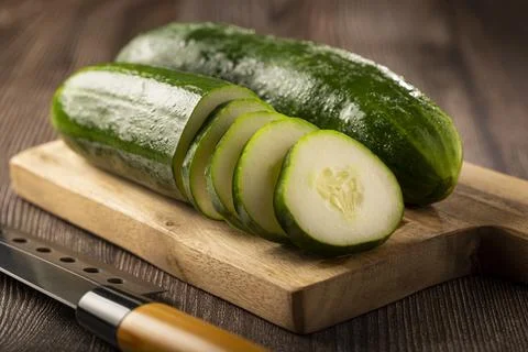 Fresh cucumber sliced ??on the table. Stock Photos