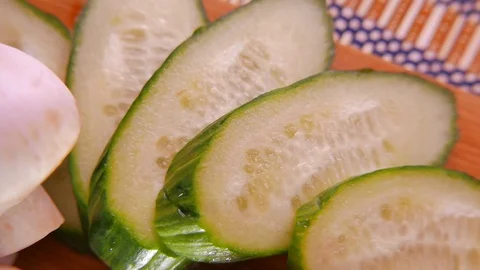 Fresh Cucumber Slices Rotating. 4K UHD Stock Footage 73111150