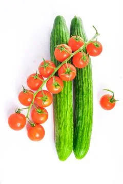 Fresh cucumbers and tomatoes Stock Photos