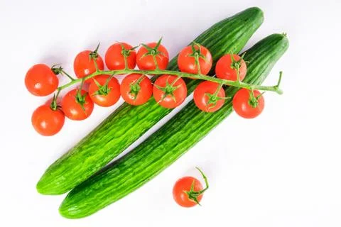 Fresh cucumbers and tomatoes Stock Photos