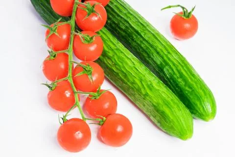 Fresh cucumbers and tomatoes Stock Photos