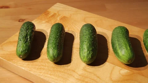 Fresh cucumbers on a board Stock Footage 52088831